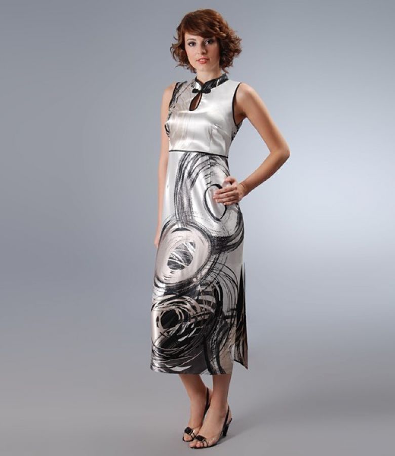 Long dress in print satin with decorative clasp