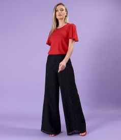 Lace pants with a jersey blouse with wide sleeves