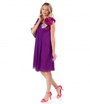 Elegant dress made of voile with satin flowers at the neckline