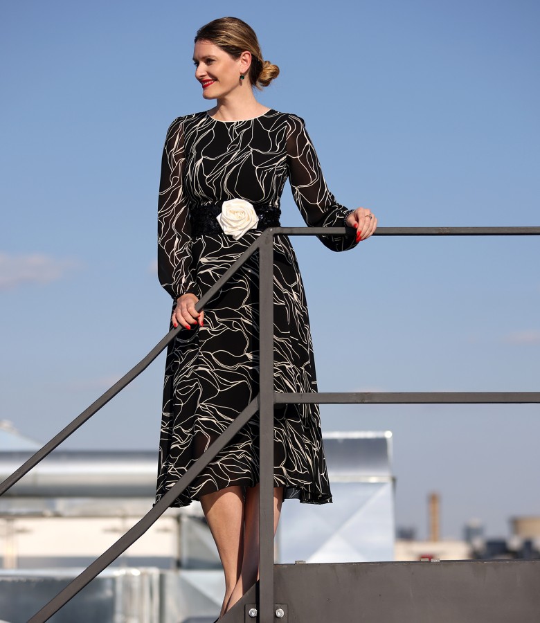 Elegant outfit with viscose midi dress, sequin girdle and white flower brooch