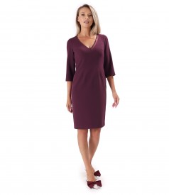 Office dress with decorative chain at the neckline