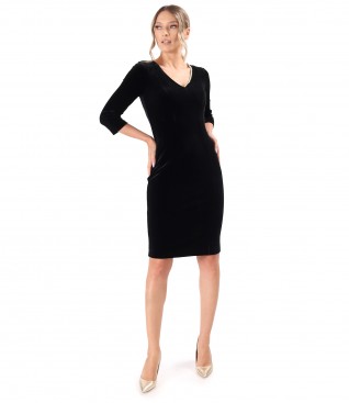 Elegant dress made of black elastic velvet with pearls at the neckline