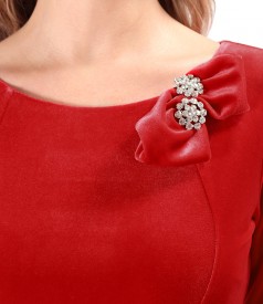 Elegant dress made of elastic velvet with crystals brooch