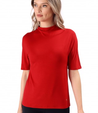 Elastic jersey blouse with decolletage on the neck