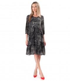 Elegant dress with ruffles in viscose printed with floral motifs